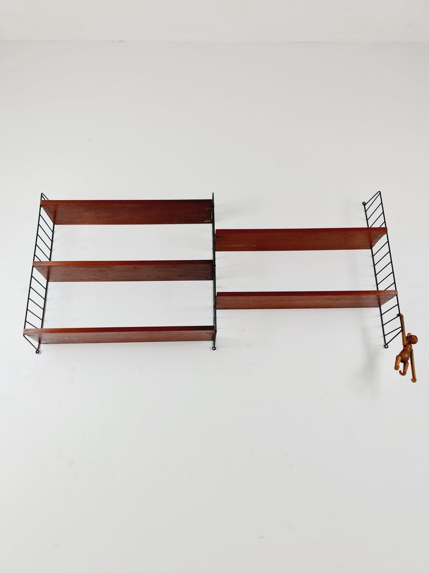 Original MCM Teak shelving system - consists of black lacquered metal ladders, from string Stockholm 1960s