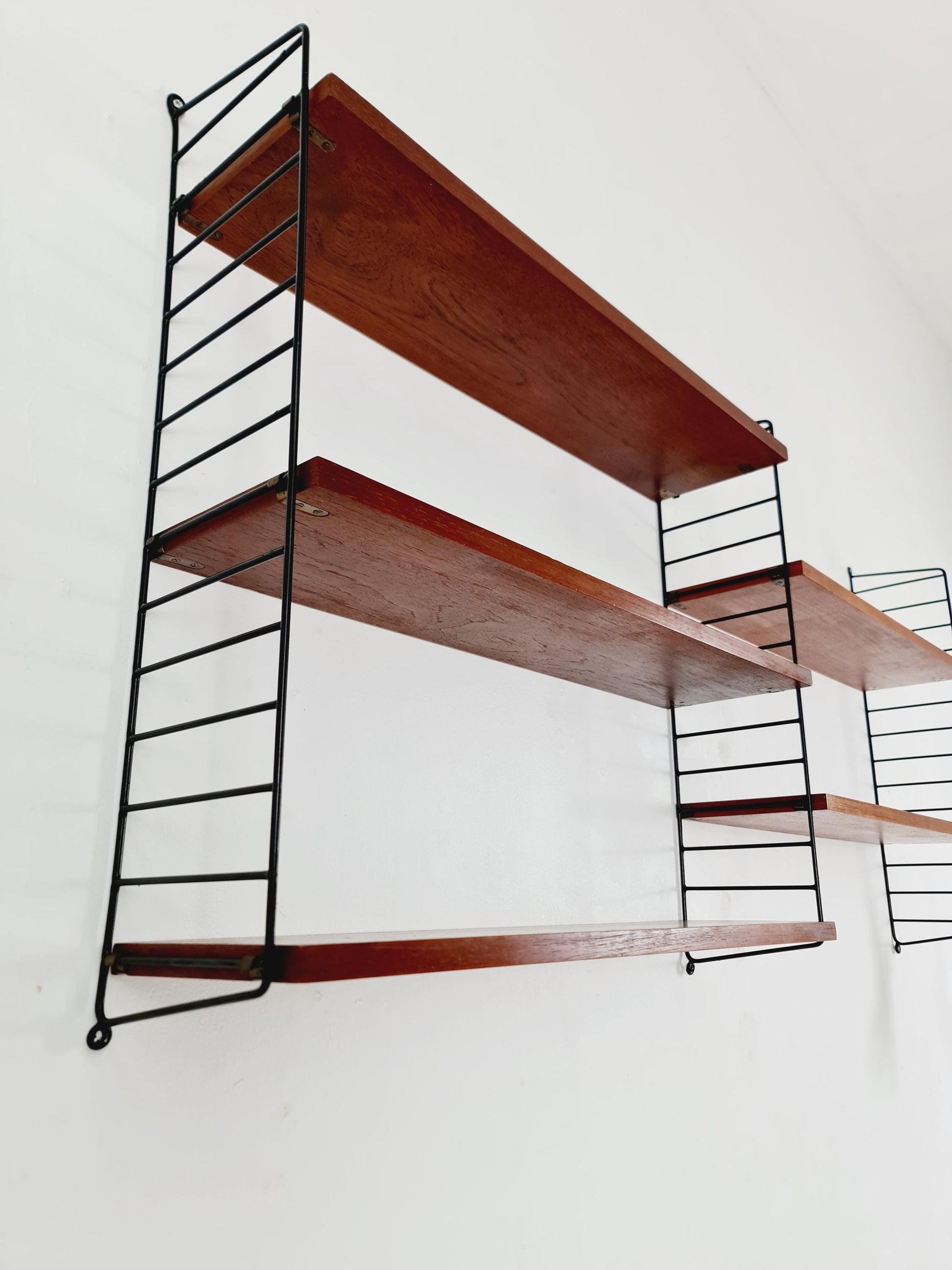Original MCM Teak shelving system - consists of black lacquered metal ladders, from string Stockholm 1960s