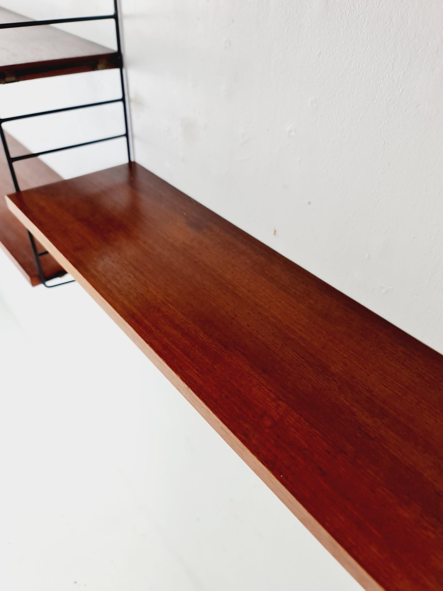 Original MCM Teak shelving system - consists of black lacquered metal ladders, from string Stockholm 1960s