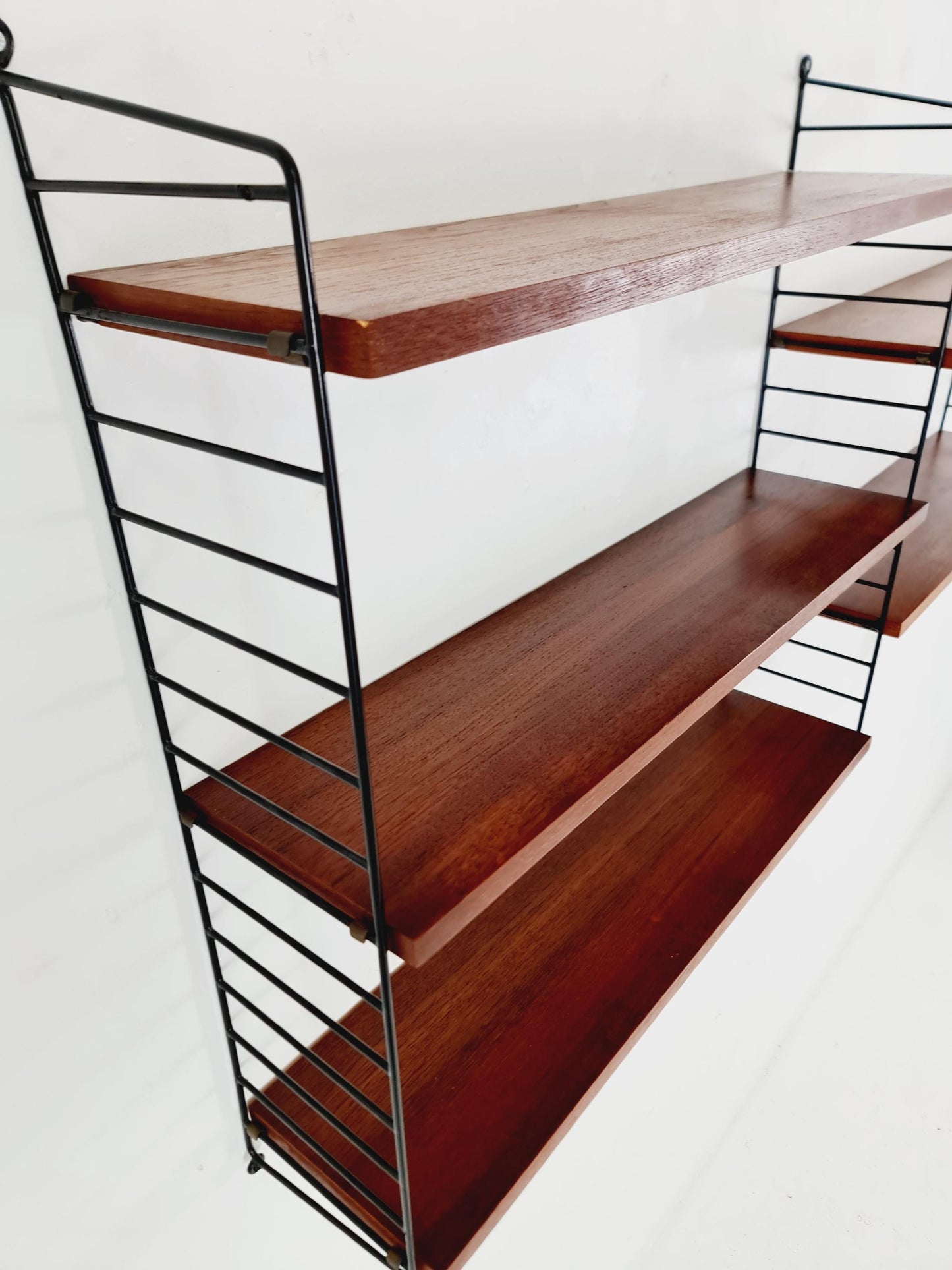 Original MCM Teak shelving system - consists of black lacquered metal ladders, from string Stockholm 1960s