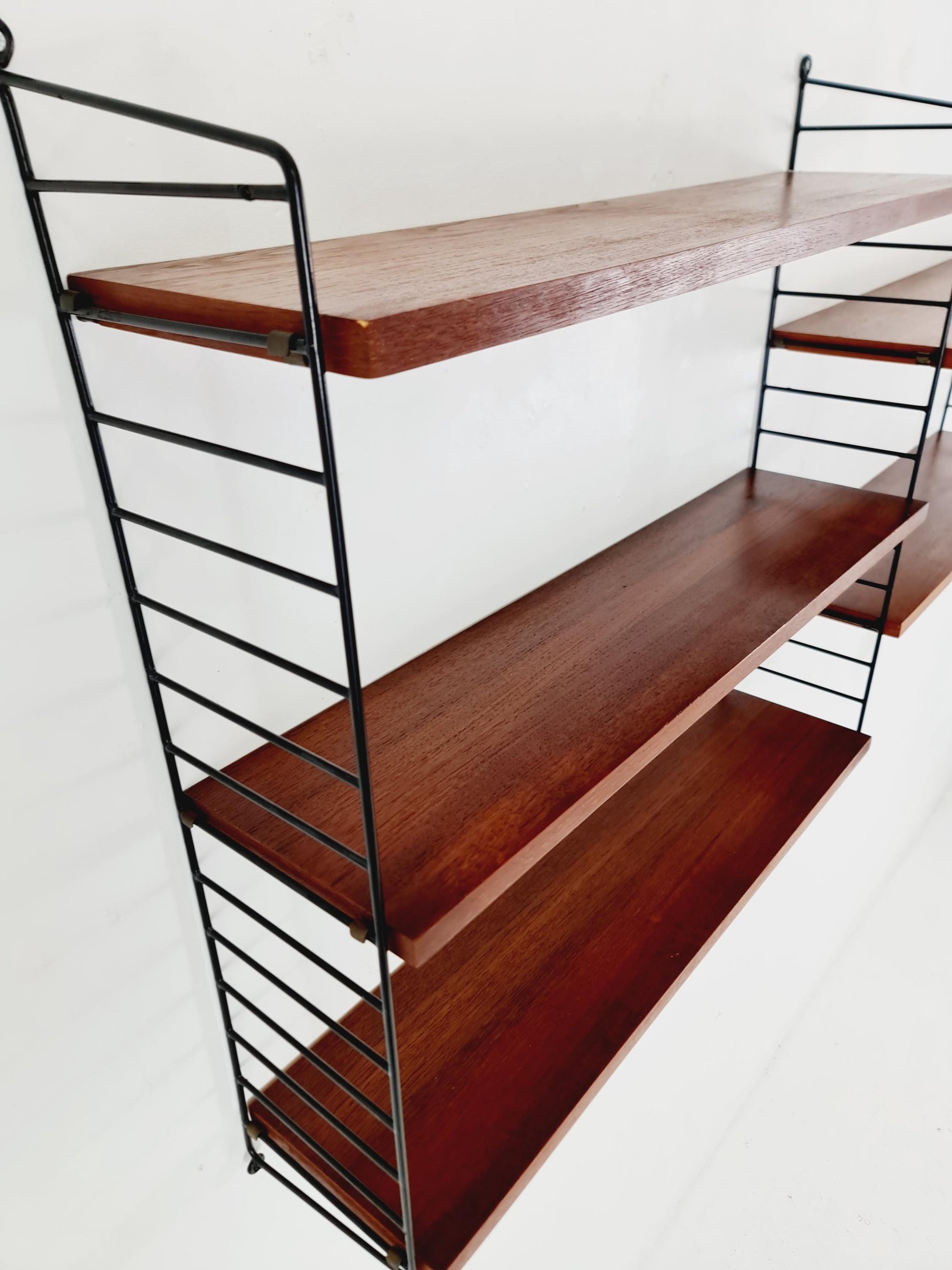 Original MCM Teak shelving system - consists of black lacquered metal ladders, from string Stockholm 1960s