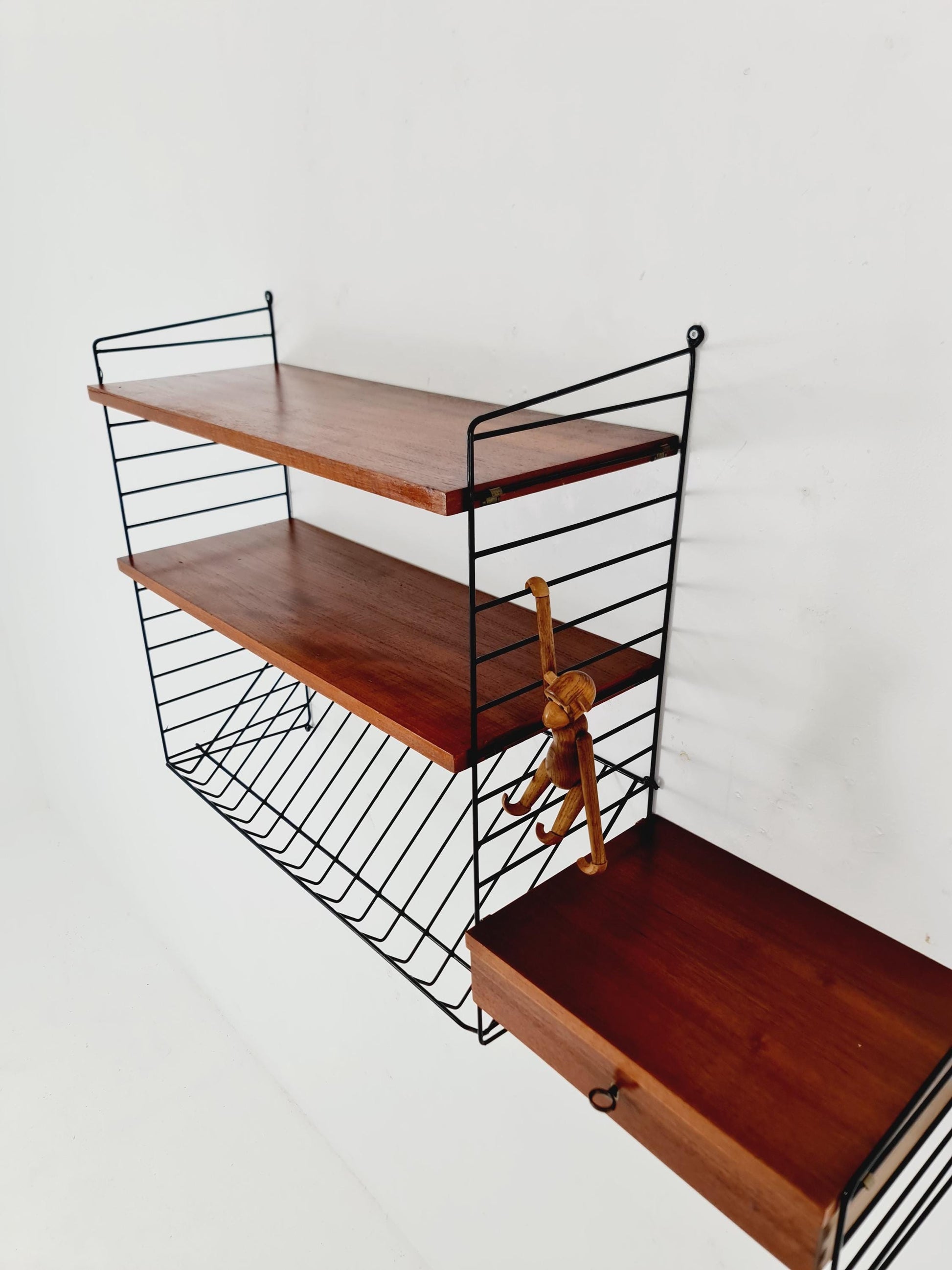 Original MCM Teak shelving system - consists of black lacquered metal ladders, from string Stockholm 1960s