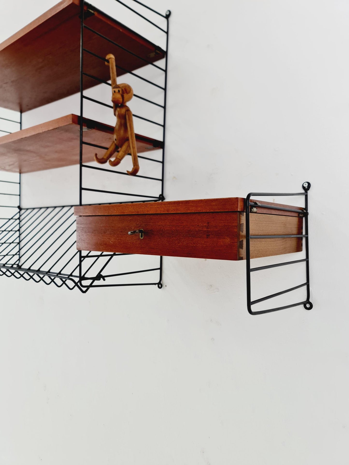 Original MCM Teak shelving system - consists of black lacquered metal ladders, from string Stockholm 1960s