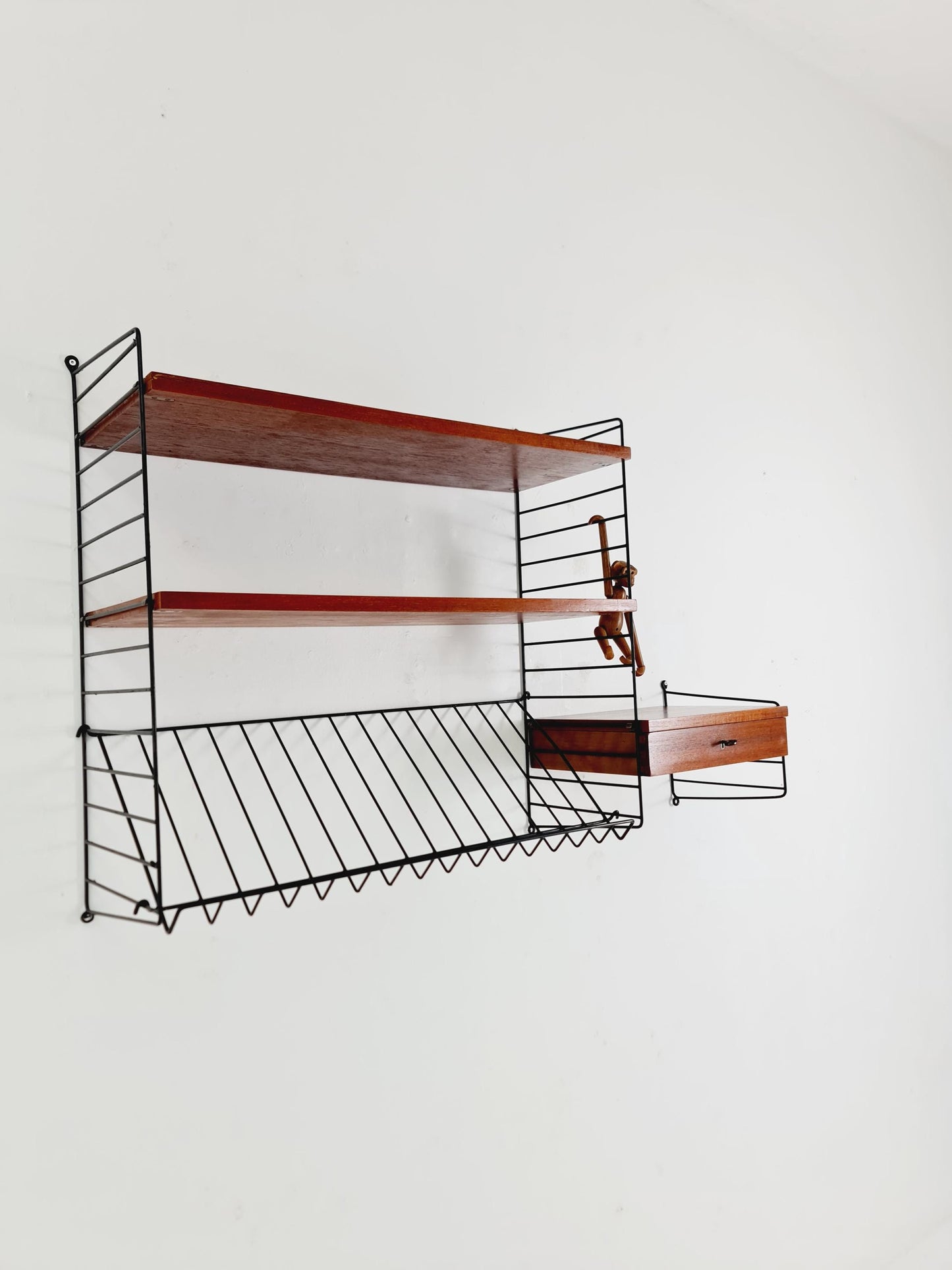 Original MCM Teak shelving system - consists of black lacquered metal ladders, from string Stockholm 1960s