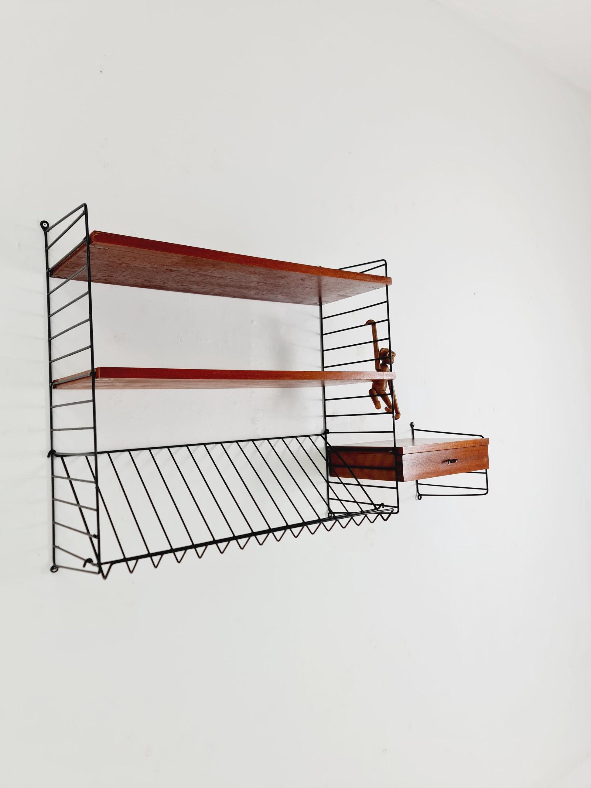 Original MCM Teak shelving system - consists of black lacquered metal ladders, from string Stockholm 1960s