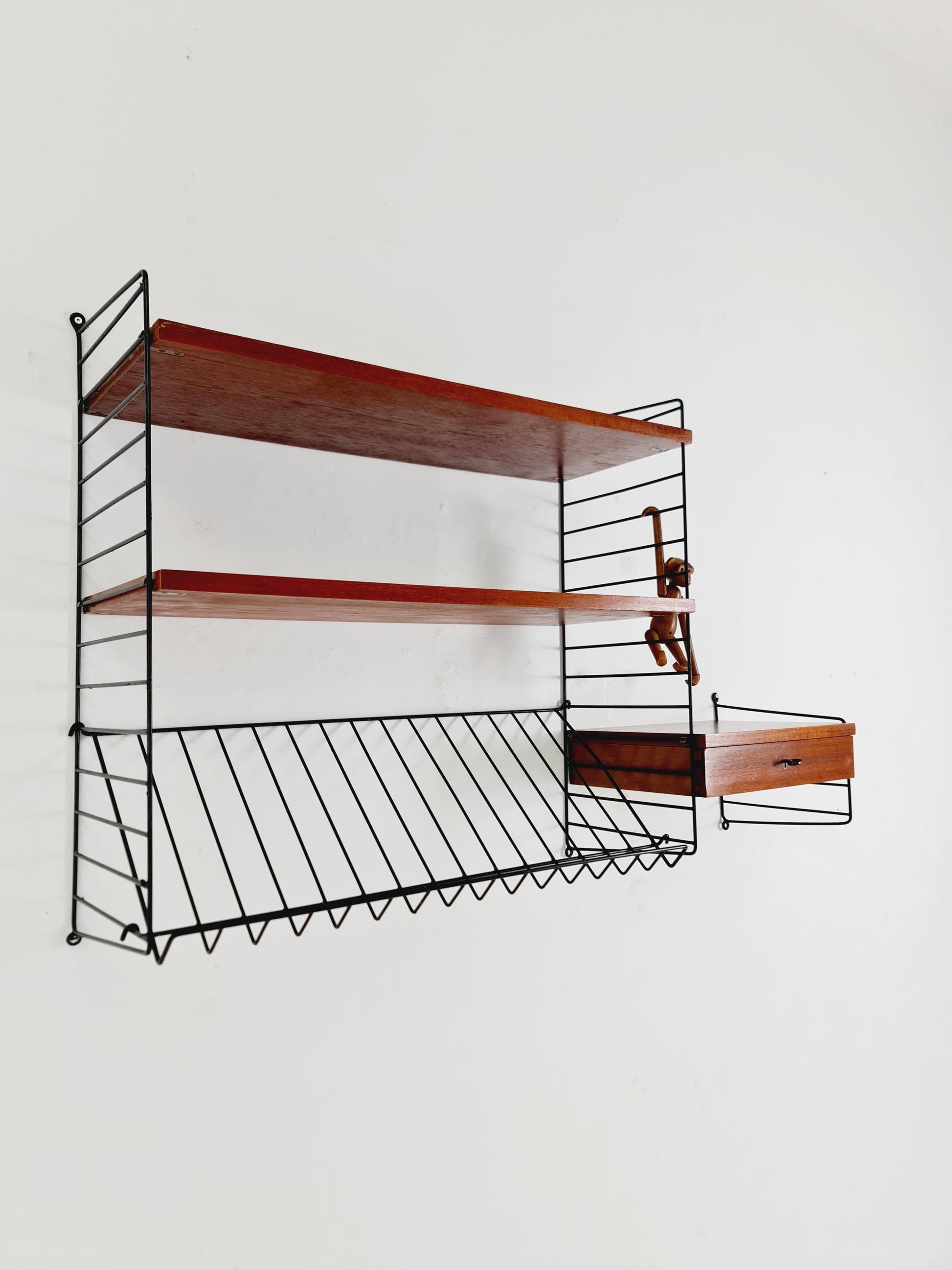 Original MCM Teak shelving system - consists of black lacquered metal ladders, from string Stockholm 1960s
