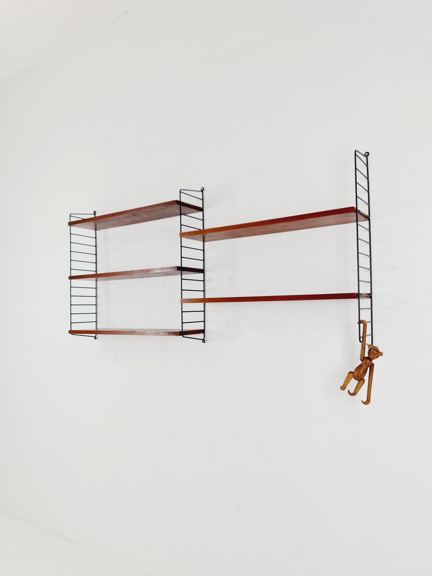Original MCM Teak shelving system - consists of black lacquered metal ladders, from string Stockholm 1960s