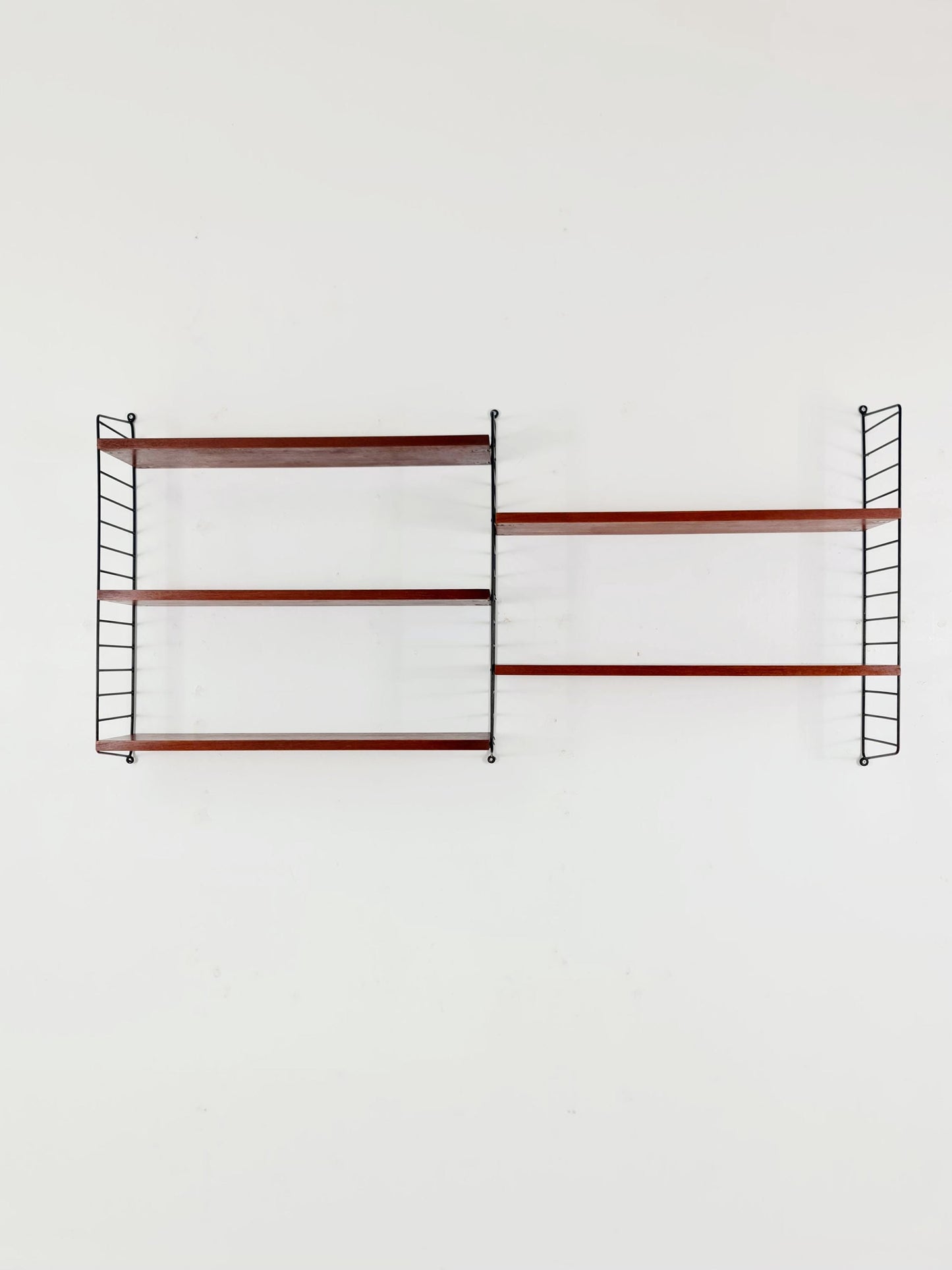Original MCM Teak shelving system - consists of black lacquered metal ladders, from string Stockholm 1960s