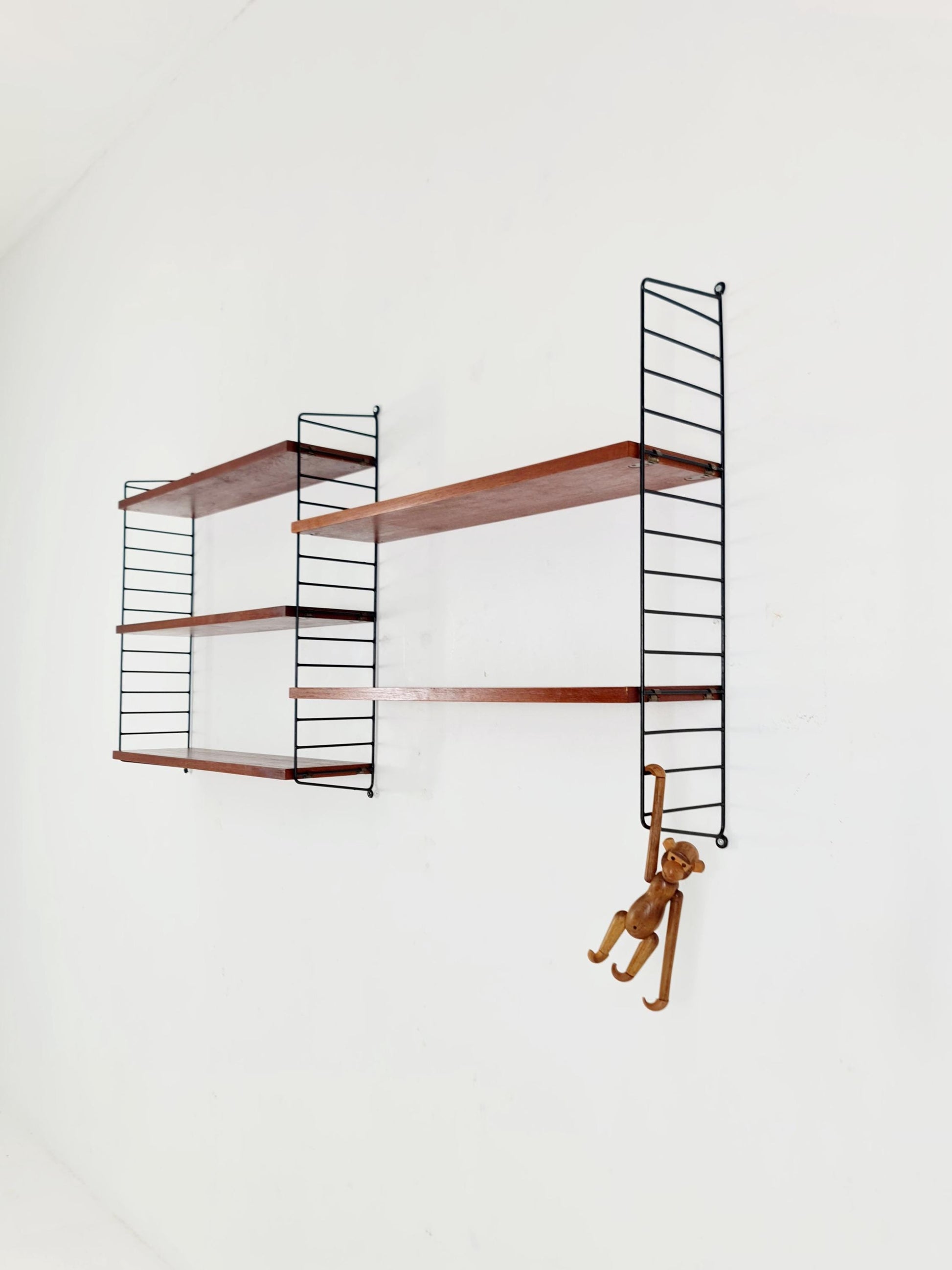 Original MCM Teak shelving system - consists of black lacquered metal ladders, from string Stockholm 1960s