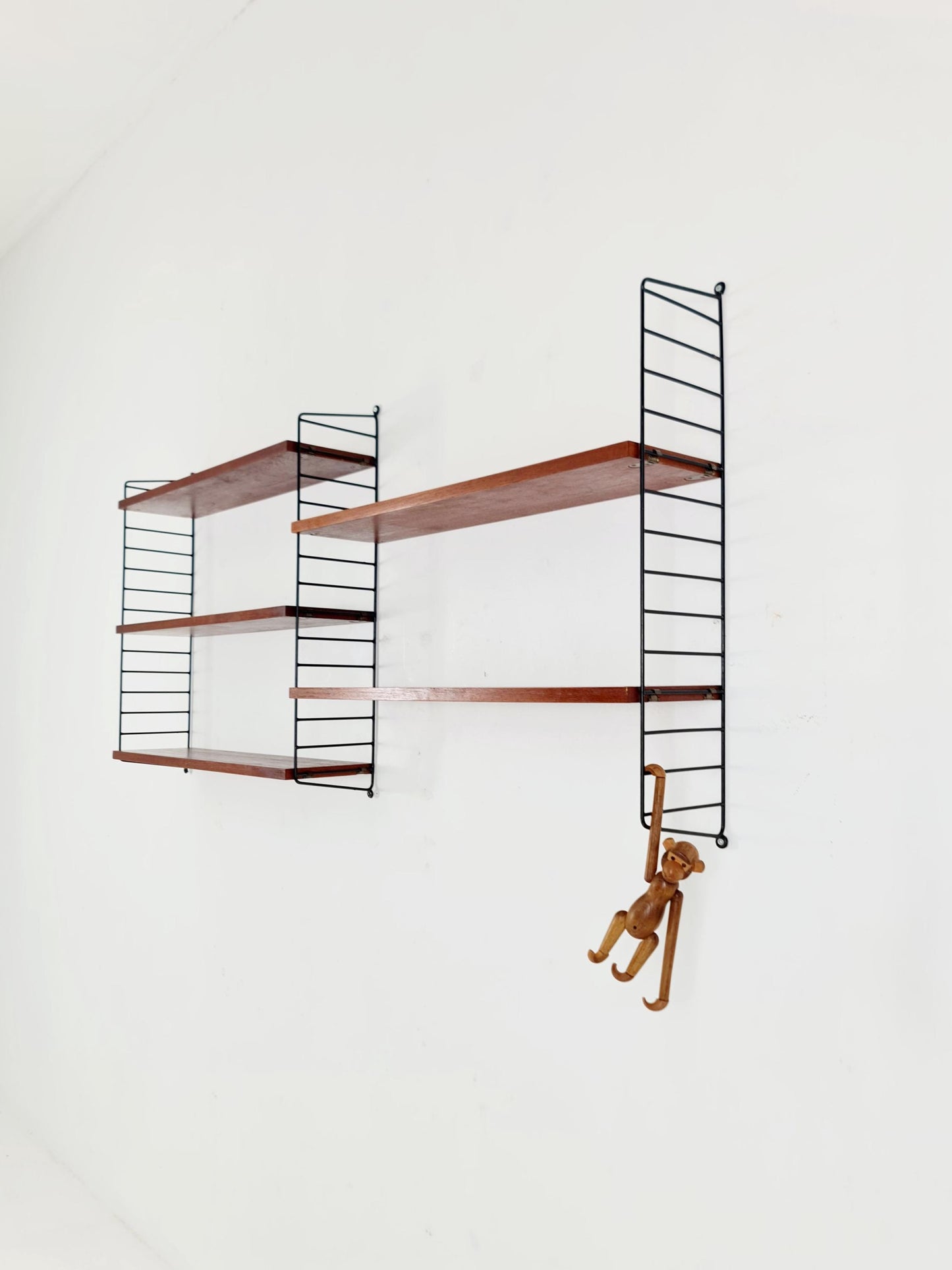 Original MCM Teak shelving system - consists of black lacquered metal ladders, from string Stockholm 1960s