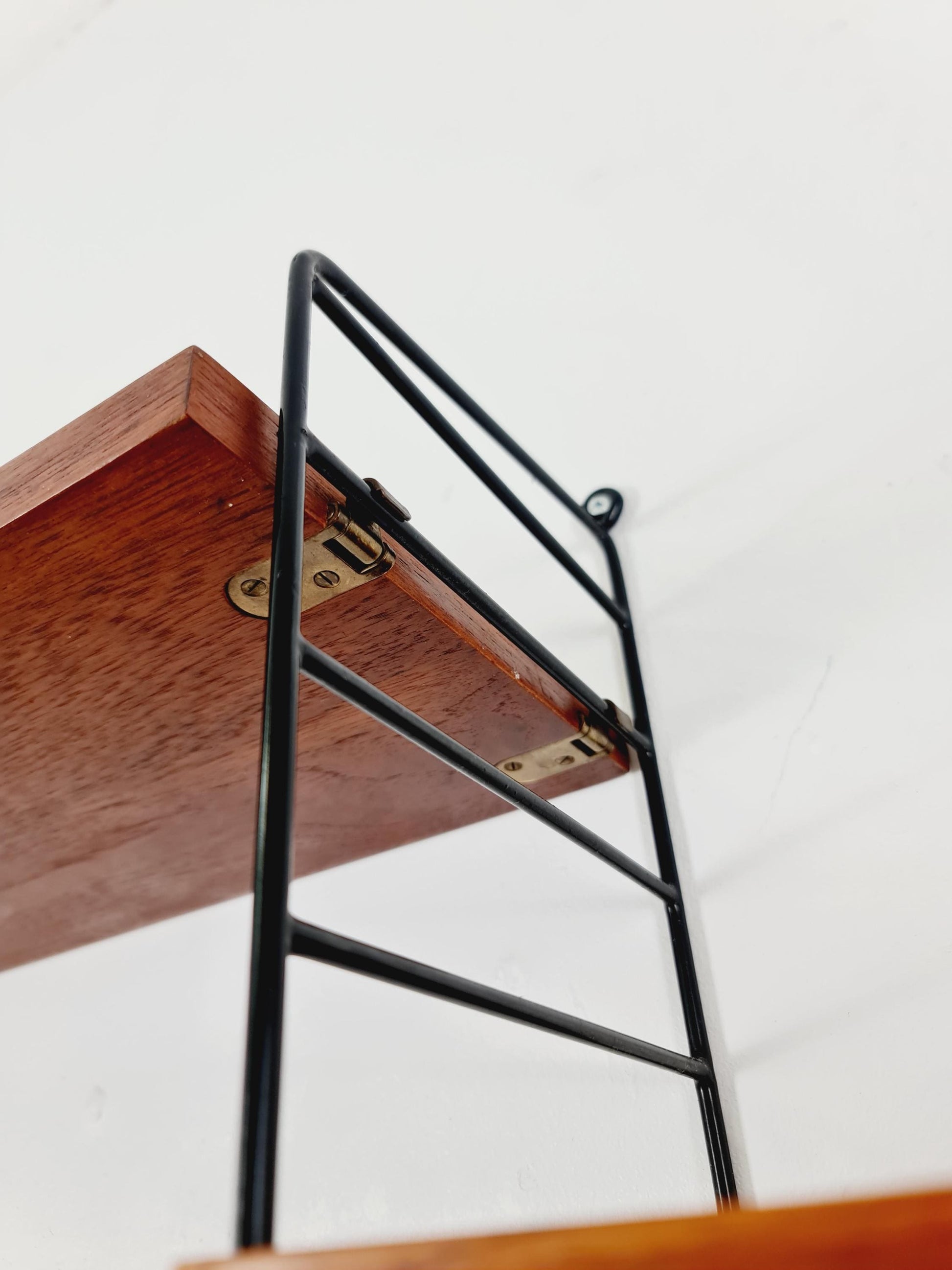 Original MCM Teak shelving system - consists of black lacquered metal ladders, from string Stockholm 1960s