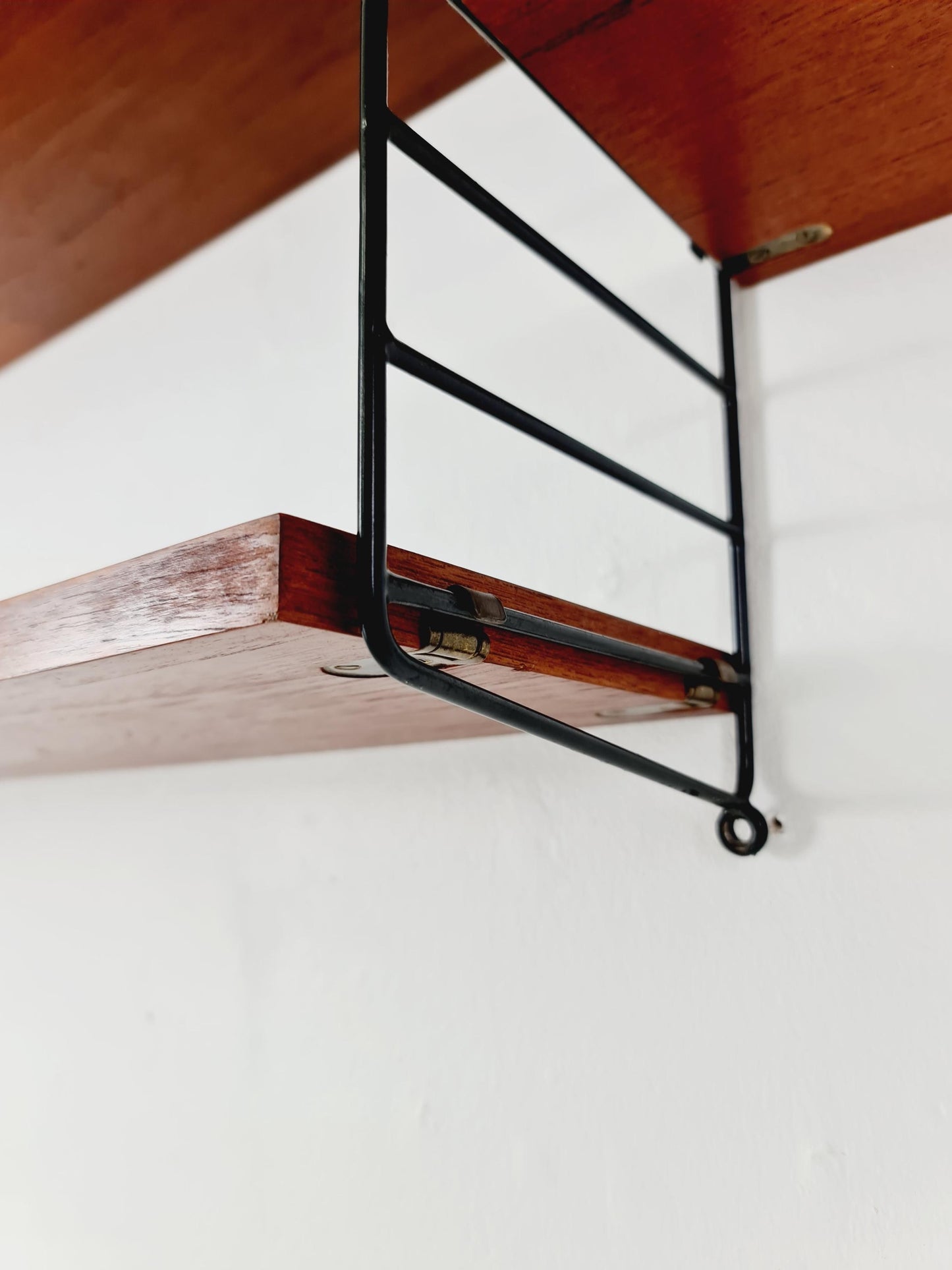 Original MCM Teak shelving system - consists of black lacquered metal ladders, from string Stockholm 1960s