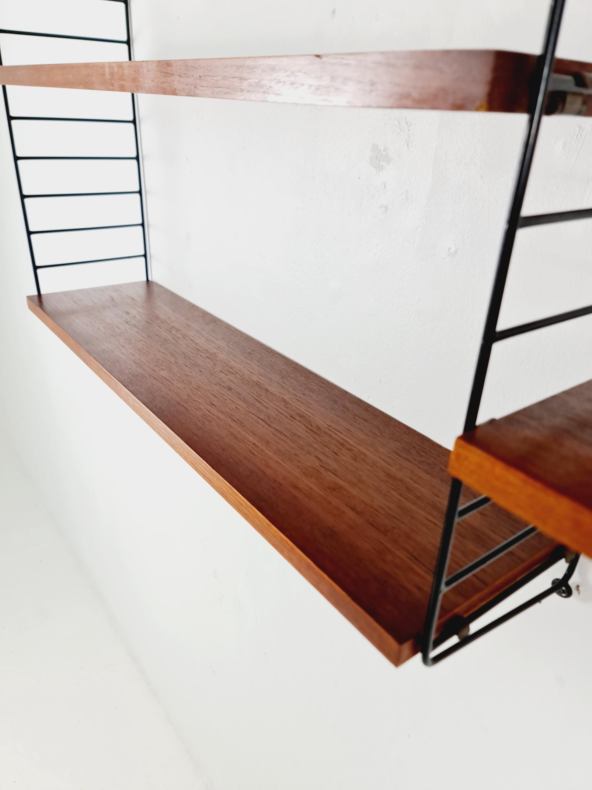 Original MCM Teak shelving system - consists of black lacquered metal ladders, from string Stockholm 1960s