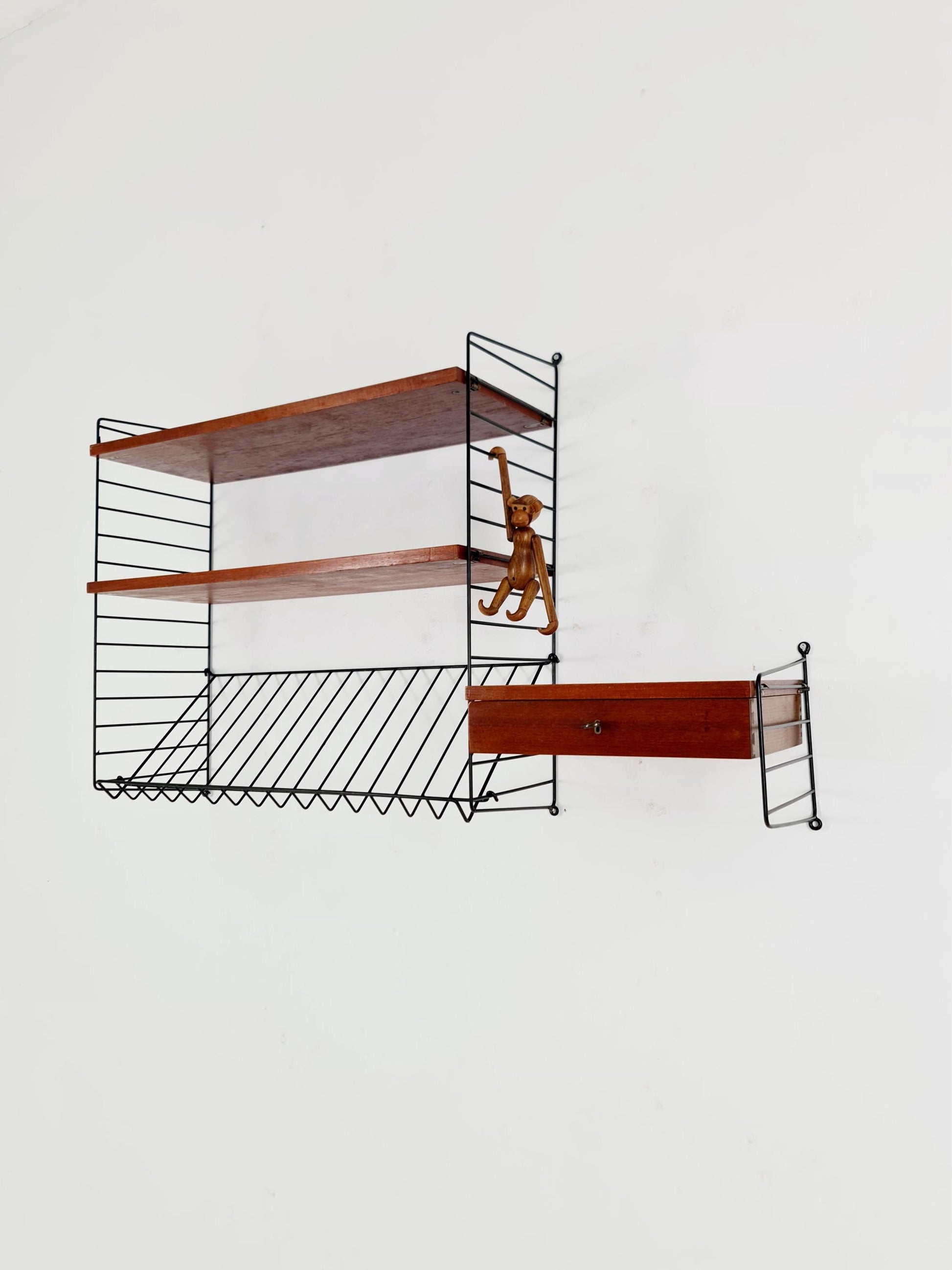 Original MCM Teak shelving system - consists of black lacquered metal ladders, from string Stockholm 1960s