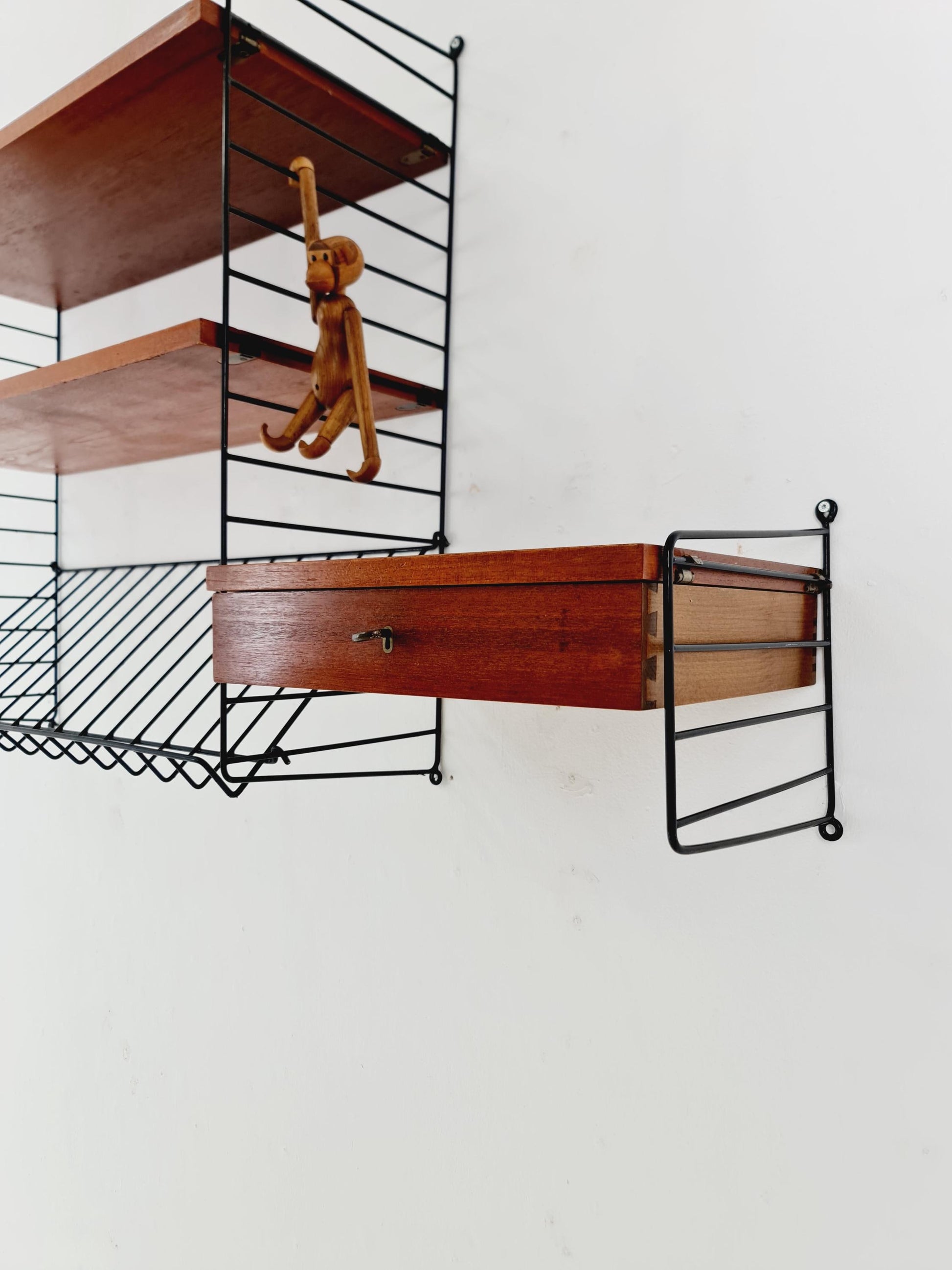 Original MCM Teak shelving system - consists of black lacquered metal ladders, from string Stockholm 1960s