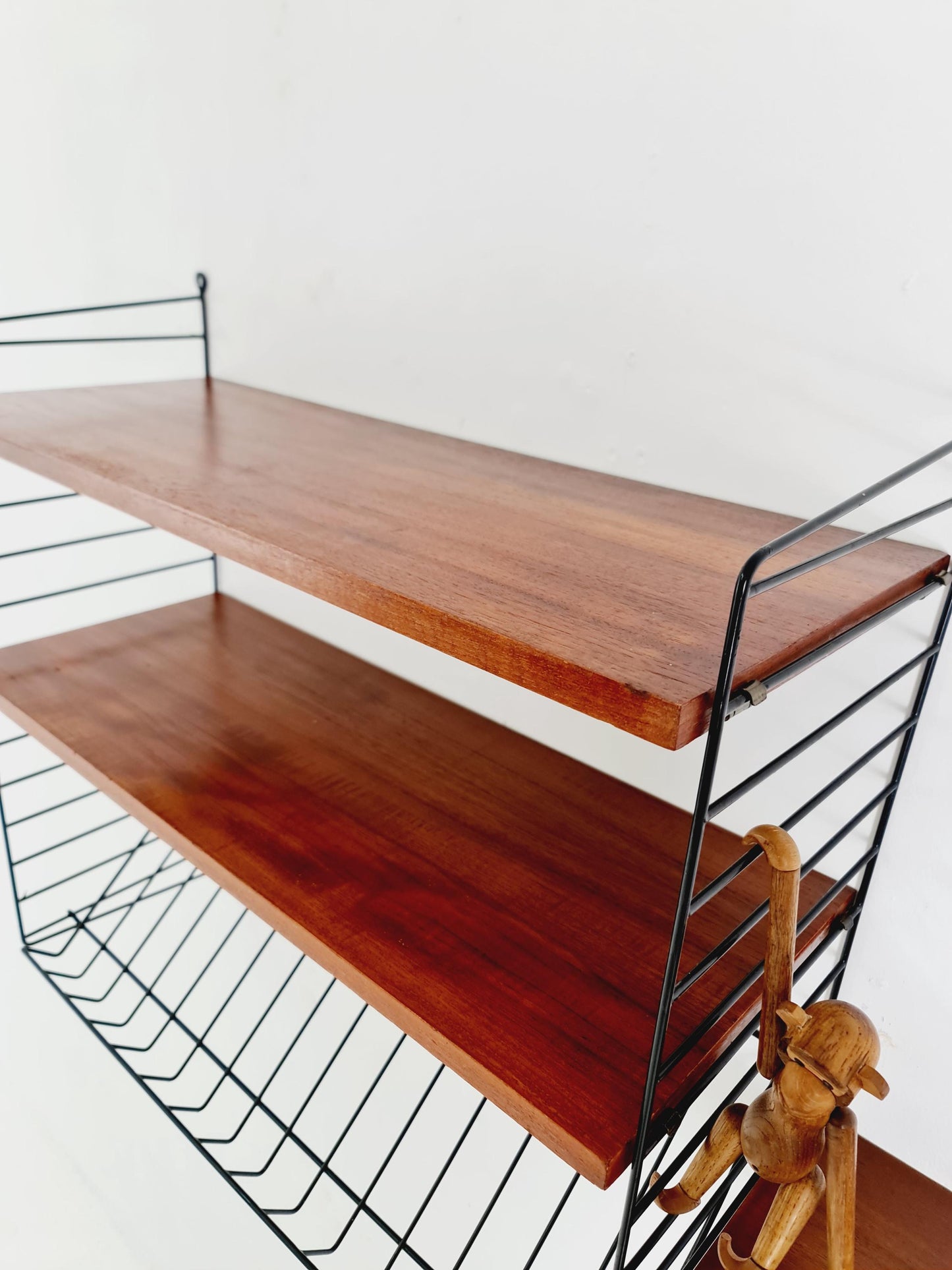 Original MCM Teak shelving system - consists of black lacquered metal ladders, from string Stockholm 1960s