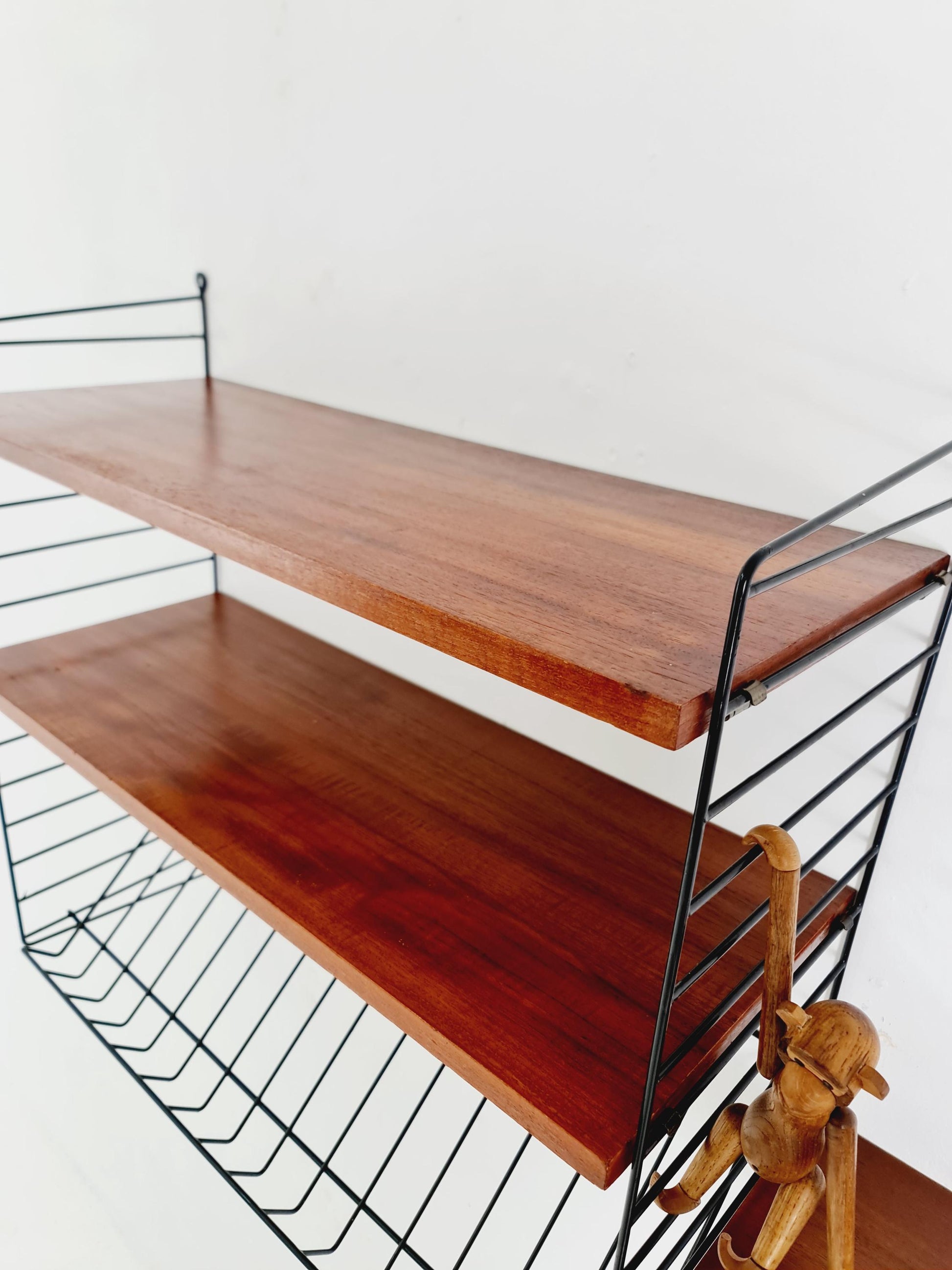 Original MCM Teak shelving system - consists of black lacquered metal ladders, from string Stockholm 1960s