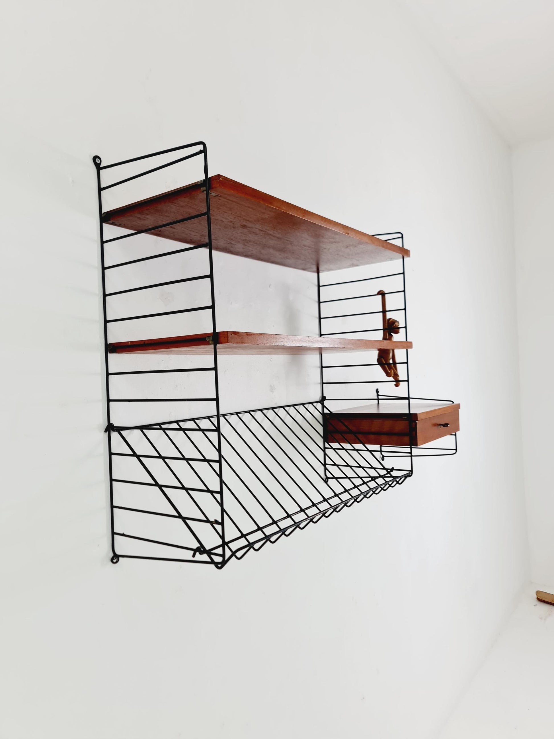 Original MCM Teak shelving system - consists of black lacquered metal ladders, from string Stockholm 1960s