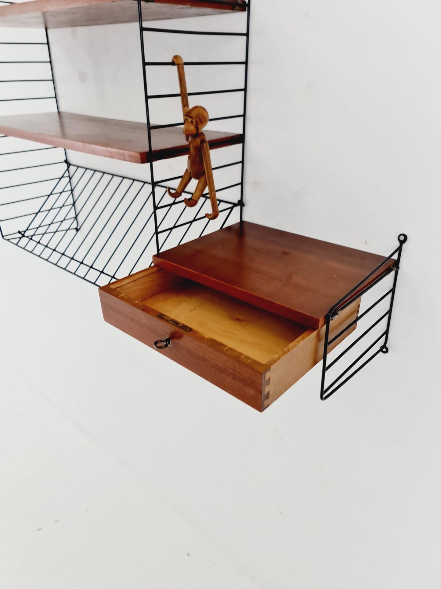 Original MCM Teak shelving system - consists of black lacquered metal ladders, from string Stockholm 1960s