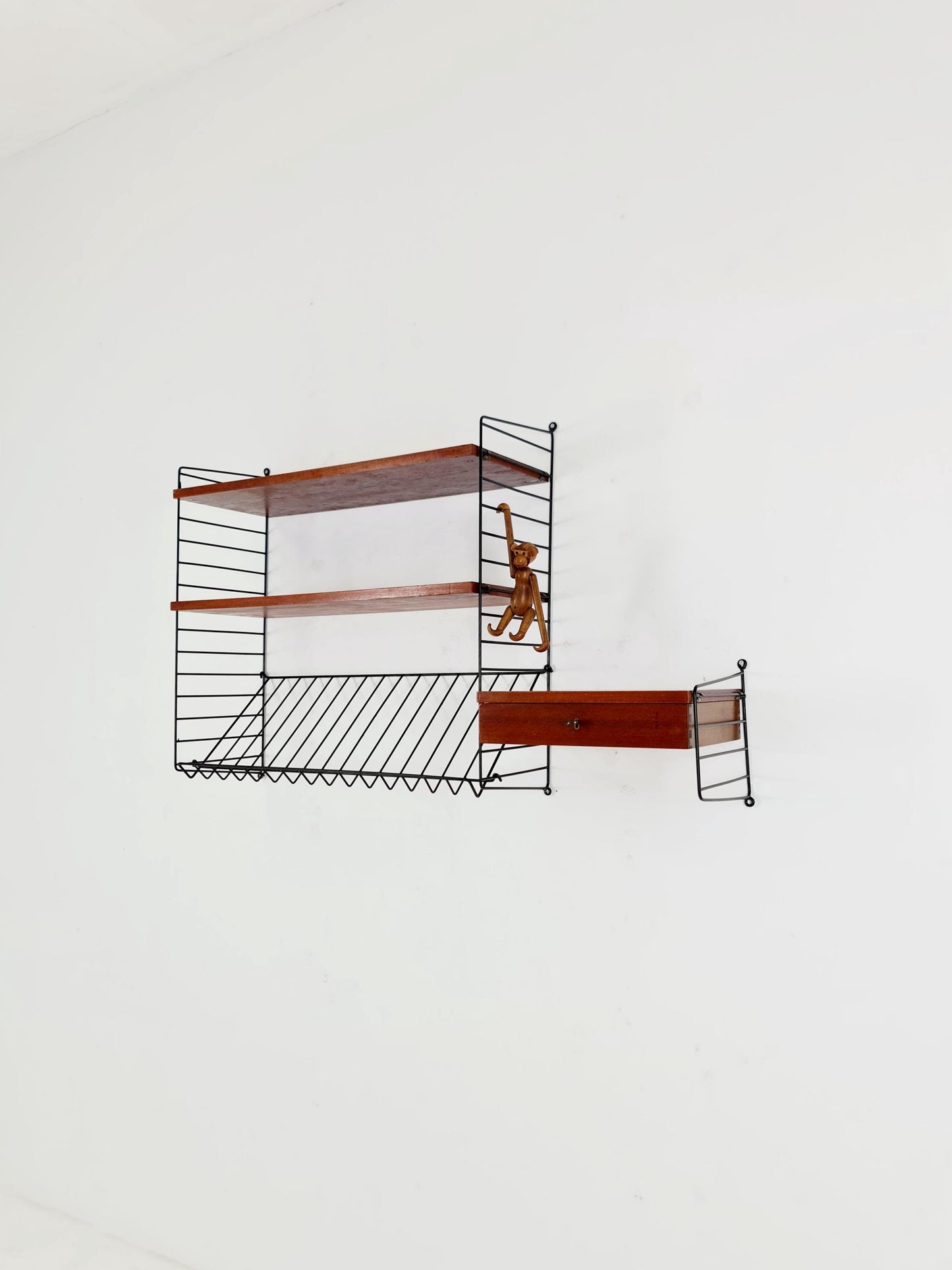 Original MCM Teak shelving system - consists of black lacquered metal ladders, from string Stockholm 1960s