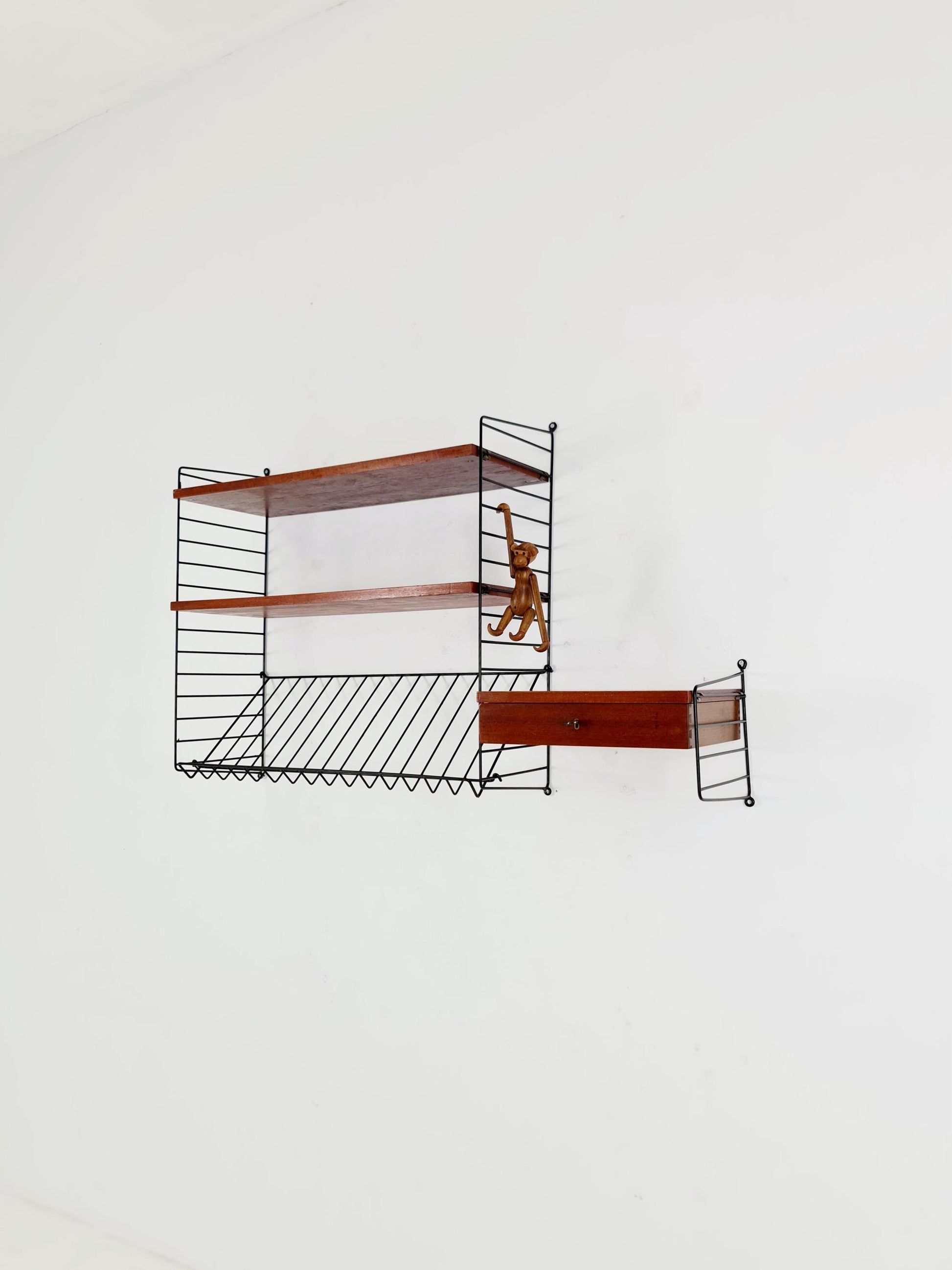 Original MCM Teak shelving system - consists of black lacquered metal ladders, from string Stockholm 1960s
