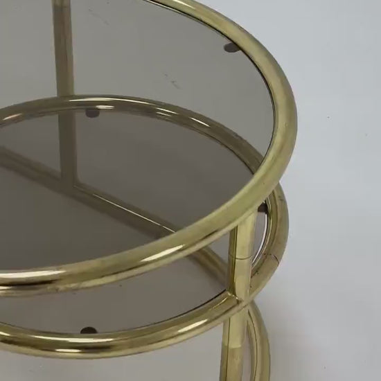 Mid century swivel coffee table brass & smoked glass ,by Milo Baughman, 1970s Italy